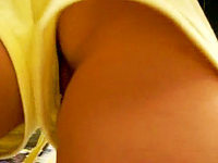 Sexy yellow shorts of this babe are so tiny that you can even peep her pussy flash.